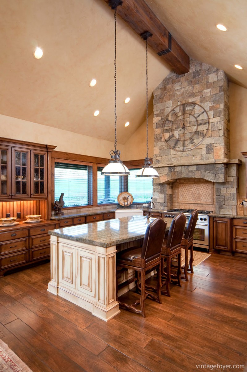 Beautiful stained wood cabinets and natural wood flooring: this kitchen is rustic and welcoming, spacious yet comfortable. 