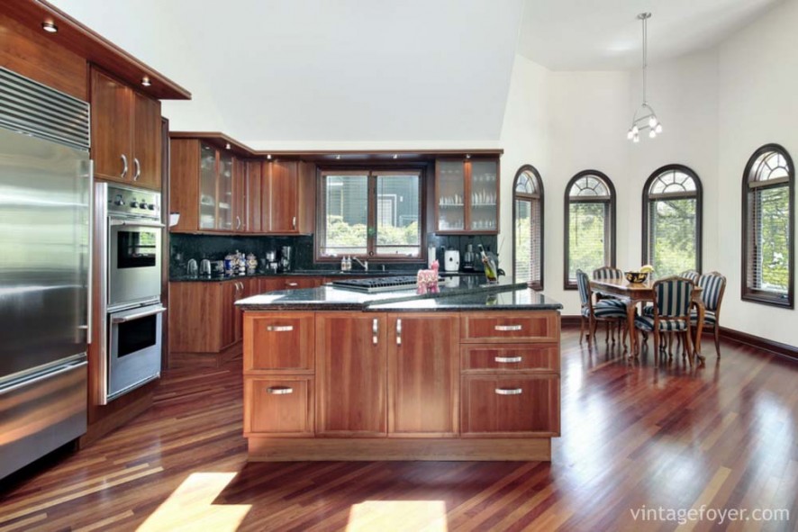 Kitchen in luxury home with cherry wood paneling