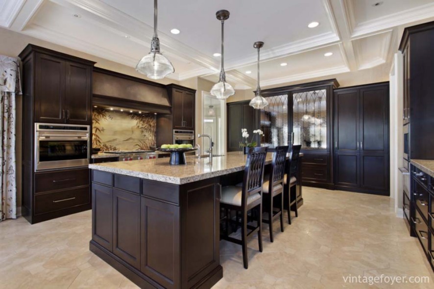 Luxury kitchen in upscale home with dark wood cabinetry