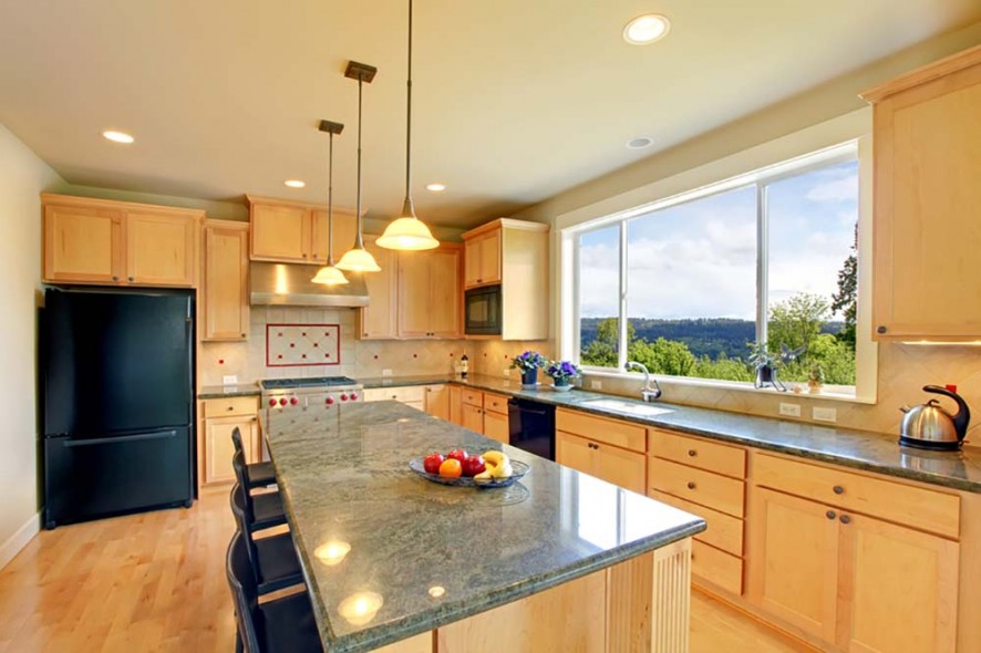 Beautiful classic wood kitchen with hardwood floor.