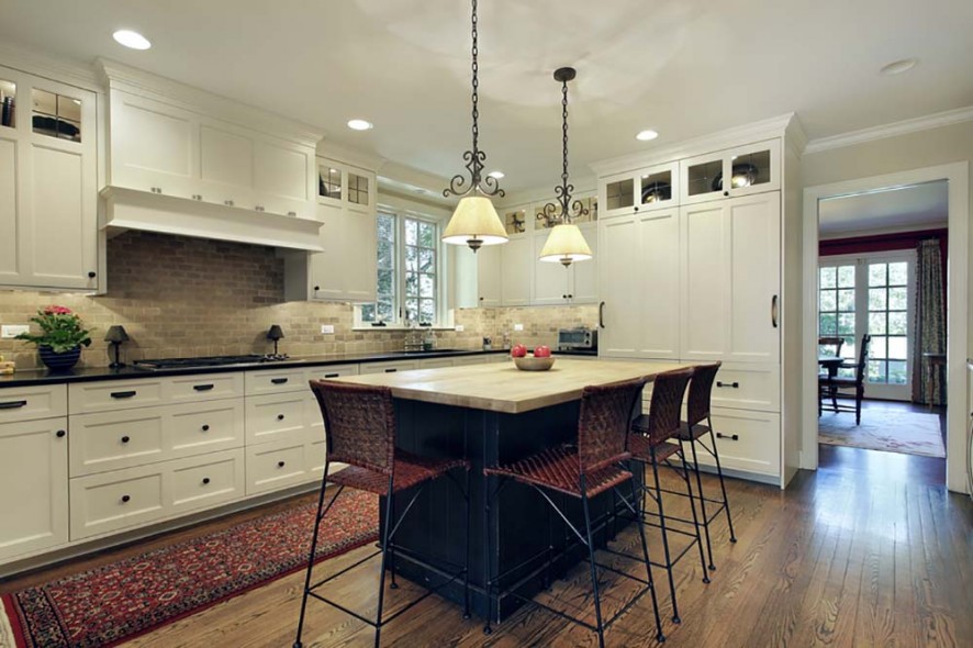 Kitchen in luxury home with wood island