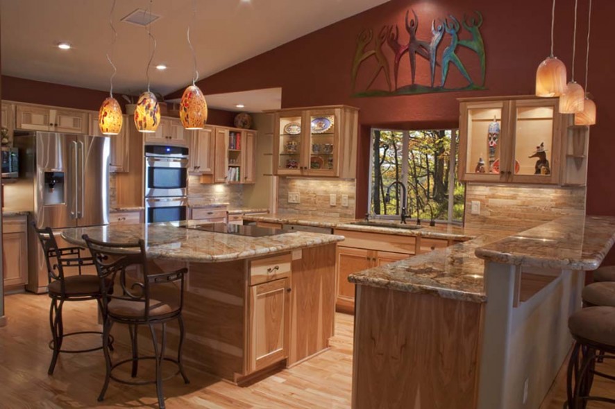 A luxury remodeled kitchen with granite countertops and stainless steel appliances