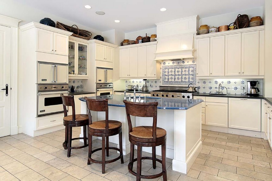 Kitchen in luxury home with marble island